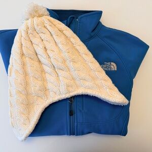 The North Face Blue Softshell Jacket with Cream Cable-Knit Pom Beanie